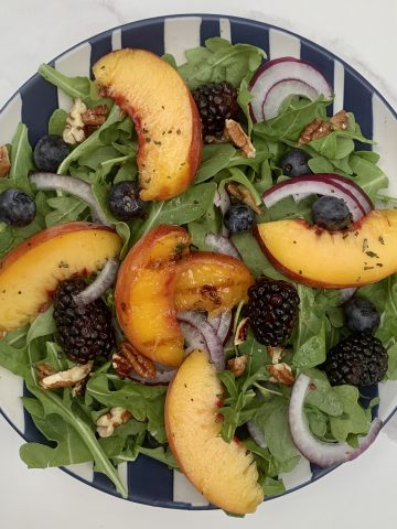 Grilled Peach Salad with Pecans plated