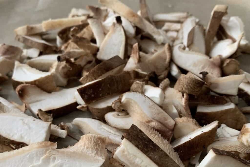 Sliced Shiitake Mushrooms on parchment paper