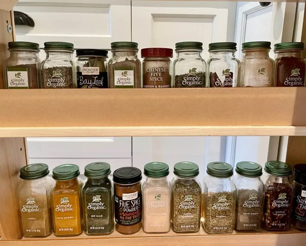 Spices alphabetized in cabinet