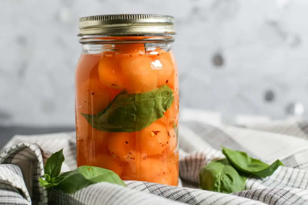 pickled cantaloupe in a mason jar