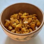Bowl of roasted butternut squash on the table.