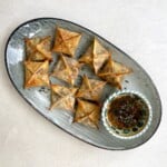 Vegetarian wontons with butternut squash filling on a platter.