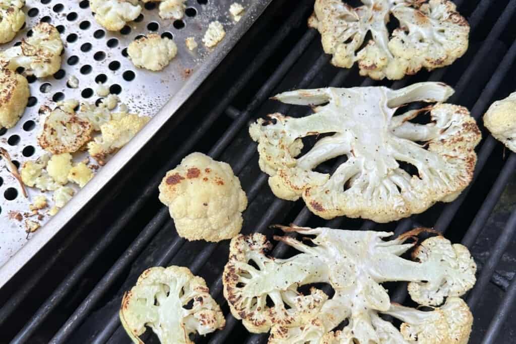Cauliflower on grill and pan.