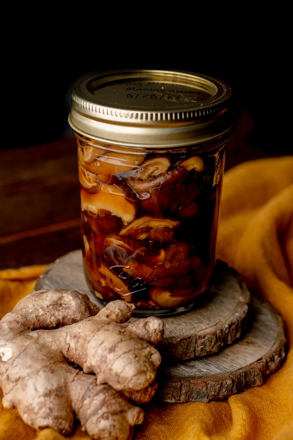 Preserving jar of marinated mushrooms.
