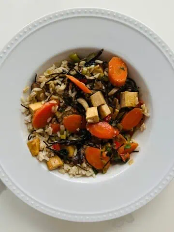 A vegetable and tofu stir fry in a bowl.