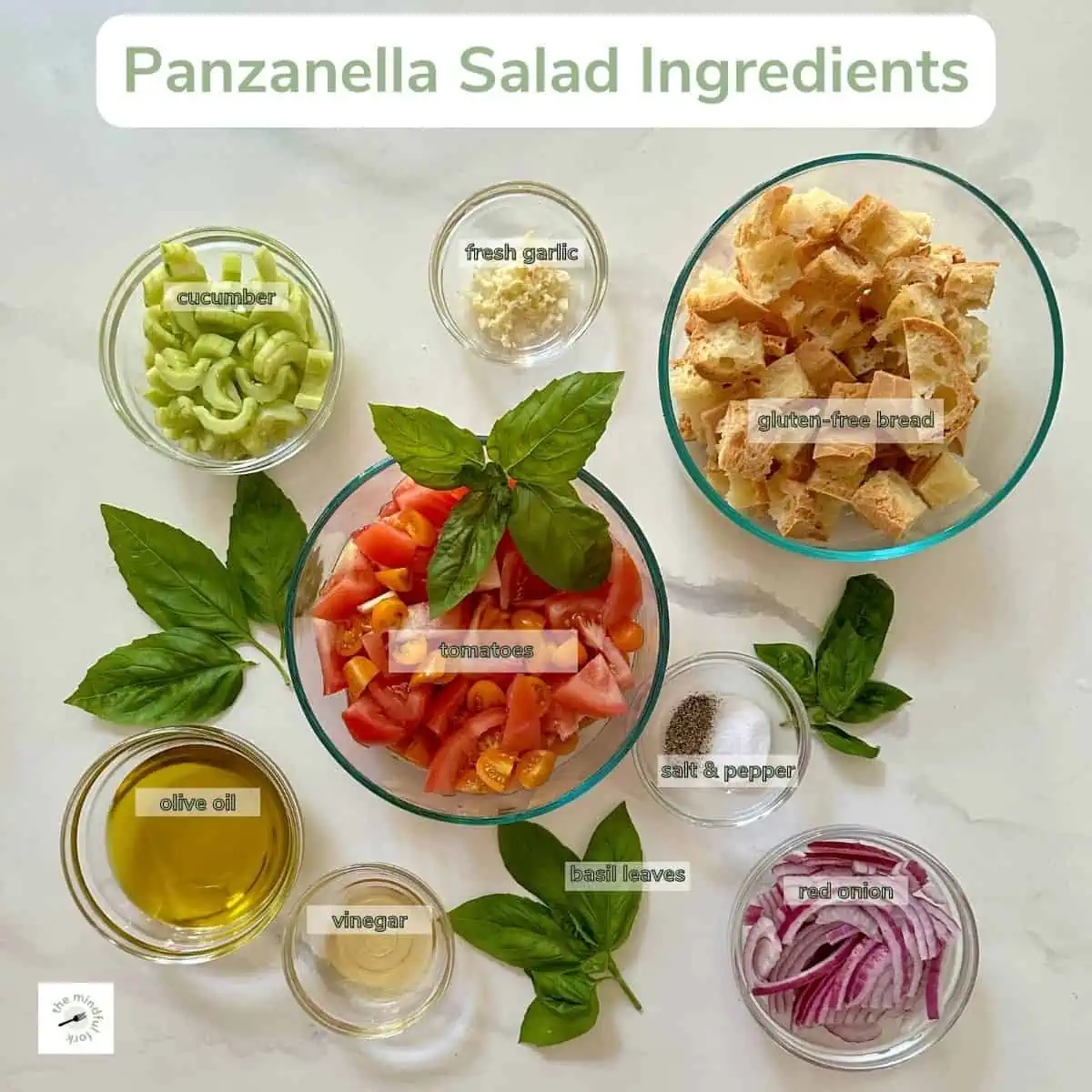 Ingredients to make panzanella salad on the table.